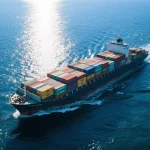 A large cargo ship carrying shipping containers, representing international shipping for wholesale bags and shoes.